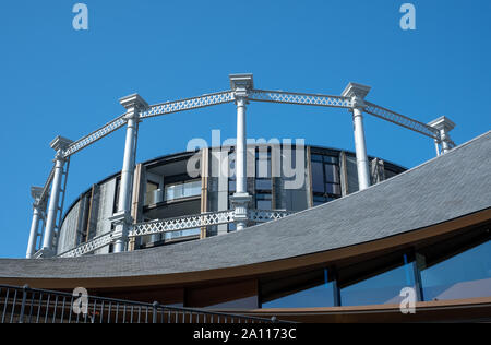 Gasholders building: block of flats, built inside disused historic Victorian gas holder in King's Cross, London UK. Photographed from Coal Drops Yard. Stock Photo