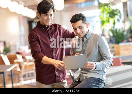 Young abroad students using digital tablet Stock Photo