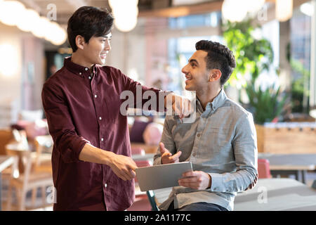 Young abroad students using digital tablet Stock Photo