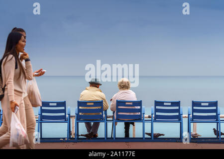Happy life and long lived concept. Handsome old man and beautiful old woman sitting together Stock Photo