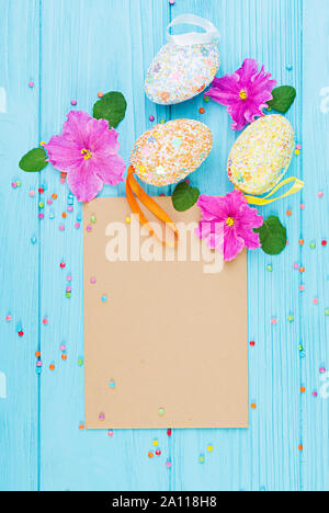 Easter background with flowers and easter eggs. Top view Stock Photo
