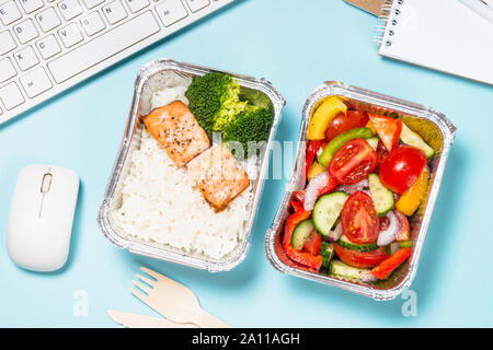 Food delivery concept - healthy lunch on office table. Stock Photo