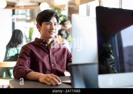 Young college student using computer Stock Photo