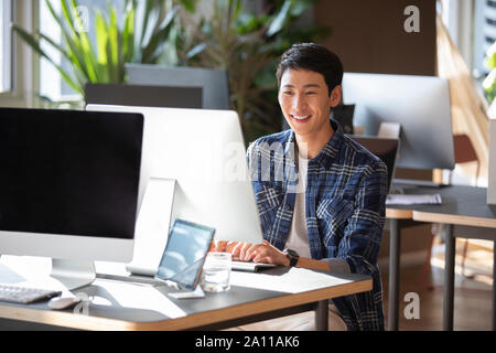 Young college student using computer Stock Photo