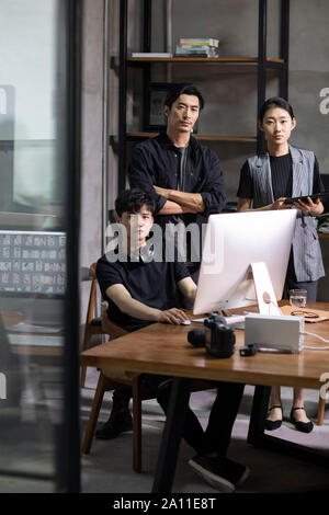 Photographers in studio Stock Photo