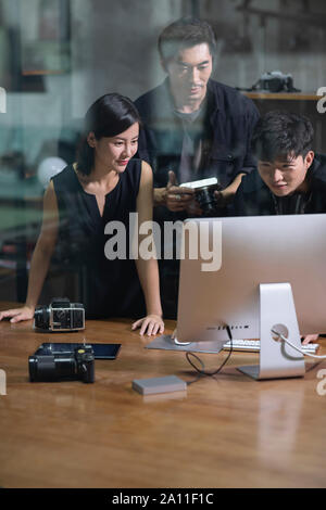Photographers working in studio Stock Photo
