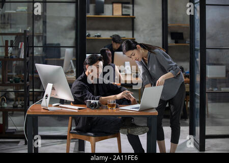Photographers working in studio Stock Photo