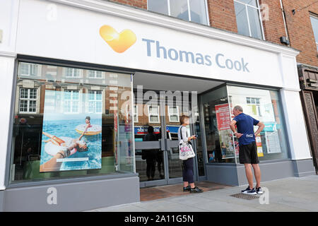 Hereford, Herefordshire, UK - Monday 23rd September 2019 - Visitors to the Thomas Cook branch in Hereford find it closed and locked at 09.30am after the company ceased trading after 178 years as a travel specialist. As yet there is no sign or notice on the store about the collapse of the business. Photo Steven May / Alamy Live News Credit: Steven May/Alamy Live News Stock Photo