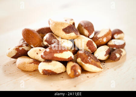 Brazil nuts on a wooden surface Stock Photo