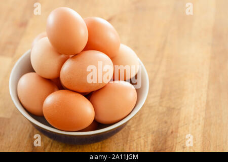 Eggs on a wooden surface Stock Photo