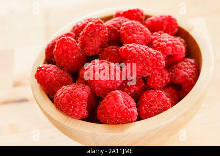Raspberries in a bowl, close up Stock Photo