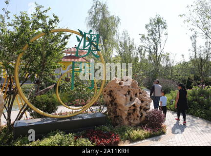 (190923) --BEIJING, Sept. 23, 2019 (Xinhua) -- Visitors tour the Macao Garden during the 'Macao Day' event of the Beijing International Horticultural Exhibition in Beijing, capital of China, Sept. 22, 2019. Macao Special Administrative Region of the People's Republic of China is on the southwestern side of the Pearl River Delta. Although it is a densely populated region, with a population of about 670,000 and an area of some 33 km?, Macao has been putting efforts on ecological protection. Macao has over 20 urban parks or gardens, four rural parks and three wetland ecological zones. Its unique Stock Photo