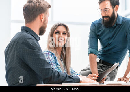 colleagues extending their hands to each other for a handshake Stock Photo
