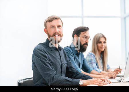 group of specialists in the headset ,working on computers. Stock Photo
