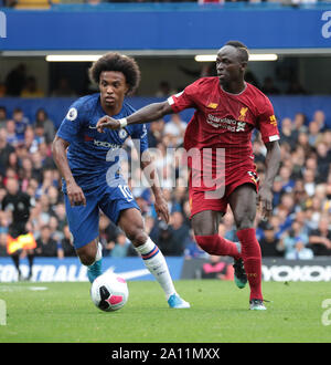 LONDON, ENGLAND - SEPTEMBER 22:  Liverpool’s Sadio Mane and Chelsea’s Willian run with the ball during the Premier League match between Chelsea FC and Liverpool FC at Stamford Bridge on September 22, 2019 in London, United Kingdom. (Hugo Philpott/MB Media) Stock Photo