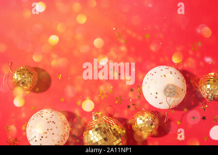 Christmas composition. Flat lay, top view. Disco ball bauble, star sparkles. Minimal New year party concept. Christmas white and gold decorations on r Stock Photo