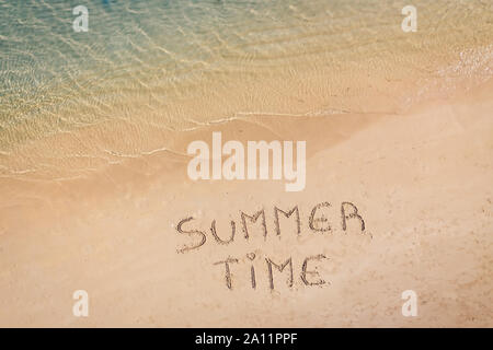 aerial view of the inscription on the sand "Summer Time", Caribbean beach and ocean seen from above Stock Photo