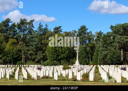 Rows of gravestones and cross in the Canadian Section of the Military Cemetery at Brookwood Cemetery, Pirbright, Woking, Surrey, southeast England, UK Stock Photo