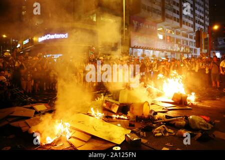 Hong Kong, China. 22nd Sep, 2019. Protesters set up the barricades and set of fires outside the Mongkok police station. Firefighters come to the rescue twice and extinguish the fire. Credit: Gonzales Photo/Alamy Live News Stock Photo