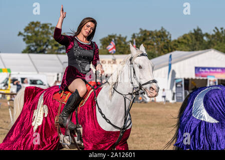 Equestrienne Stunt Shows horse display at the National Country Show Live at Hylands Park, Chelmsford, Essex, UK. Horse event team Stock Photo