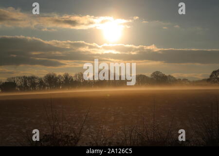 Winter sunset over farm fields Berkshire, Nebury Stock Photo