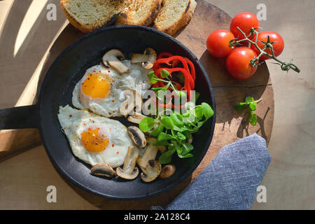Fried Eggs And Vegetables In A Frying Pan Stock Photo