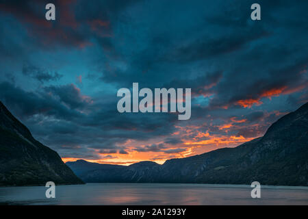 Eidfjord, Hordaland County, Hardanger Region, Hardangerfjord, Norway. Amazing Sunset Sunrise Sky Above Summer Scenic View Of Hardangerfjord Fjord. Fam Stock Photo