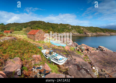 Old boats on the shore of Loch Torridon at Kenmore on the Applecross Peninsula in north west Scotland Stock Photo