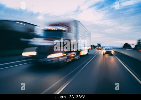 Semi truck on highway concept with motion blur Stock Photo