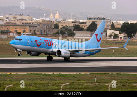 TUIfly Boeing 737-8K5 (REG: D-ATYC) on take off from runway 13 in the morning. Stock Photo