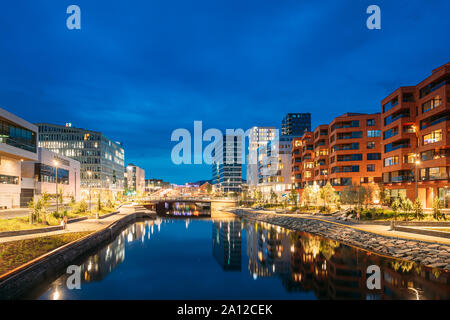 Oslo, Norway - June 25, 2019: Night View Embankment And Residential Multi-storey House In Gamle Oslo District. Summer Evening. Residential Area Reflec Stock Photo