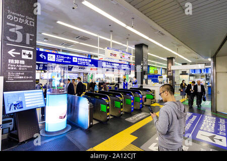 Tokyo, Hamamatsucho station interior. Transfer gate and ticket and IC card barriers for the Tokyo Monorail to Haneda airport. People. Stock Photo