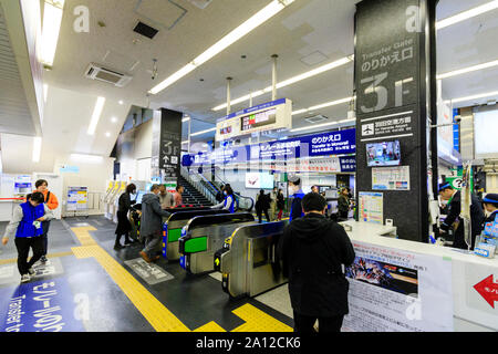 Tokyo, Hamamatsucho station interior. Transfer gate and ticket and IC card barriers for the Tokyo Monorail to Haneda airport. People. Stock Photo