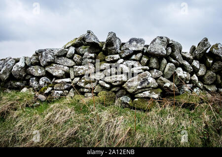 Close up of a partially collapsed dry stone wall. Stock Photo