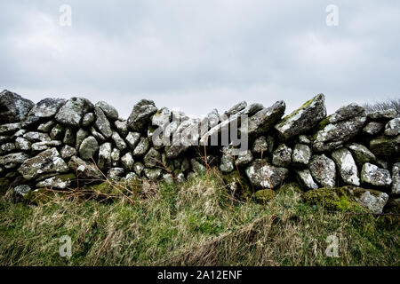 Close up of a partially collapsed dry stone wall. Stock Photo