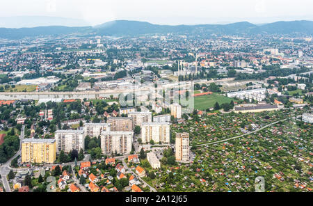 Aerial view of city Graz from helicopter drone with districts Jakomini and Gries and river Mur on a cloudy summer day in Austria, Europe Stock Photo