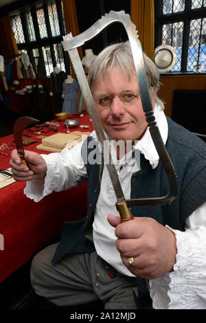 Civil War Weekend at Hereford's Black & White House. Steven Turner-Bone as 'The Surgeon' with some of the medical tools on display. Stock Photo