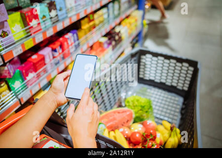 phone with empty blank white screen shopping cart on background Stock Photo