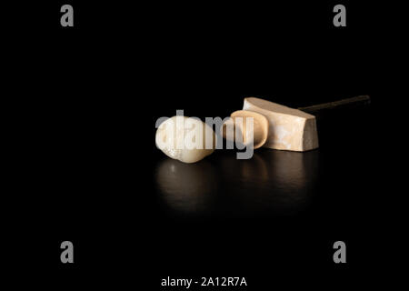 Dental veneers, ceramic and zirconium crowns of teeth close-up macro isolate on black background. Laboratory technical production  prostheses Stock Photo