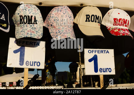 Tourist shopping, Rome hats, roman italian souvenirs on display at a stall. Rome, Italy, Europe, EU. Stock Photo