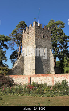 Medieval castle tower inside a walled garden Stock Photo