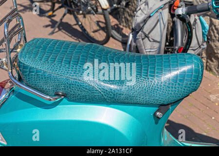 Crocodile Leather Animal Print Seat at Scooter Stock Photo - Alamy