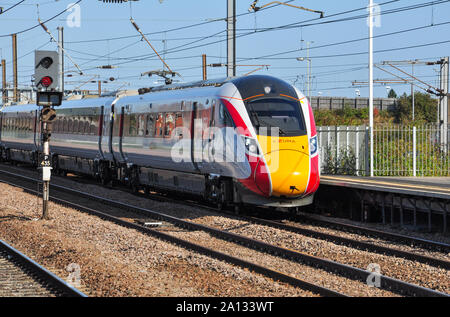 Class 800 Azuma heads a southbound express into Peterborough, Cambridgeshire, England, UK Stock Photo