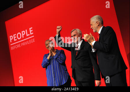 Brighton, England. 23rd September, 2019 John McDonnell, Shadow Chancellor of the Exchequer, (centre) is congratulated by Jennie Formby, General Secretary of the Labour Party (left) and Jeremy Corbyn, Leader of the Labour Party (right), following his speech to delegates, during the third day of the Labour Party annual conference at the Brighton Centre. Kevin Hayes/Alamy Live News Stock Photo