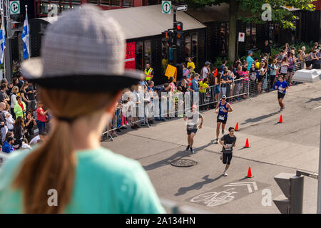 Montreal, Canada - 22 September 2019: Runners and participants are about to cross the finish line of the Marathon Stock Photo