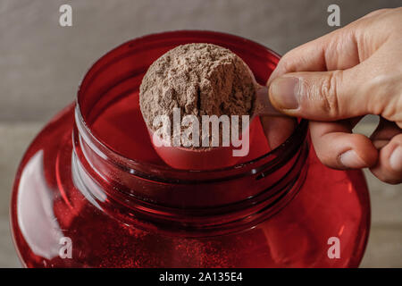 Whey protein powder supplement for after exercise workout Stock Photo