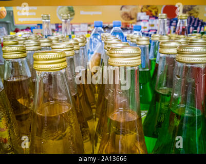 Bottles of lemonade on the shelf in the store. Stock Photo