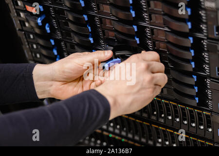 IT Consultant Replacing Server Drive In San Stock Photo