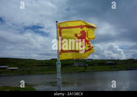 Scottish lion rampant flag in the wind, Scottish highlands. Stock Photo