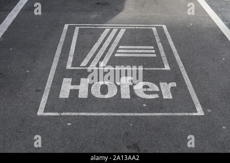Parking space marked with Hofer logo Stock Photo